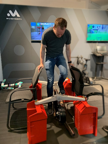 Engineer Andy riding a TiltBike upside down during testing